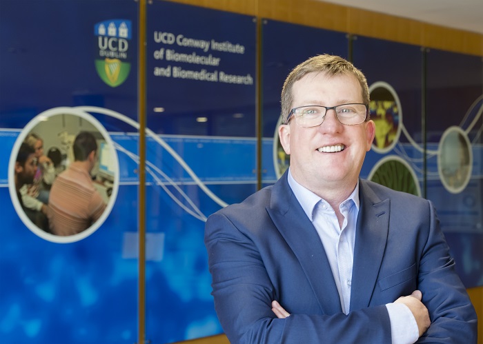 portrait photo of Professor Breandán Kennedy standing in Conway Institute Foyer